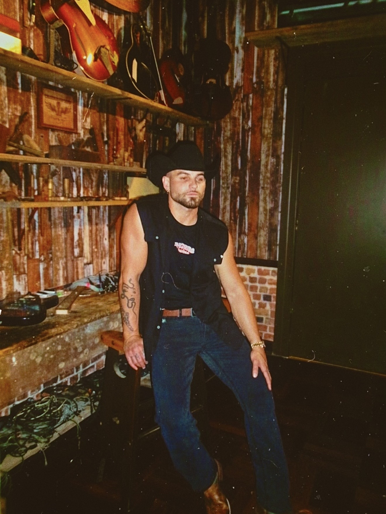 Emersxn wearing Ringers Western at a bar