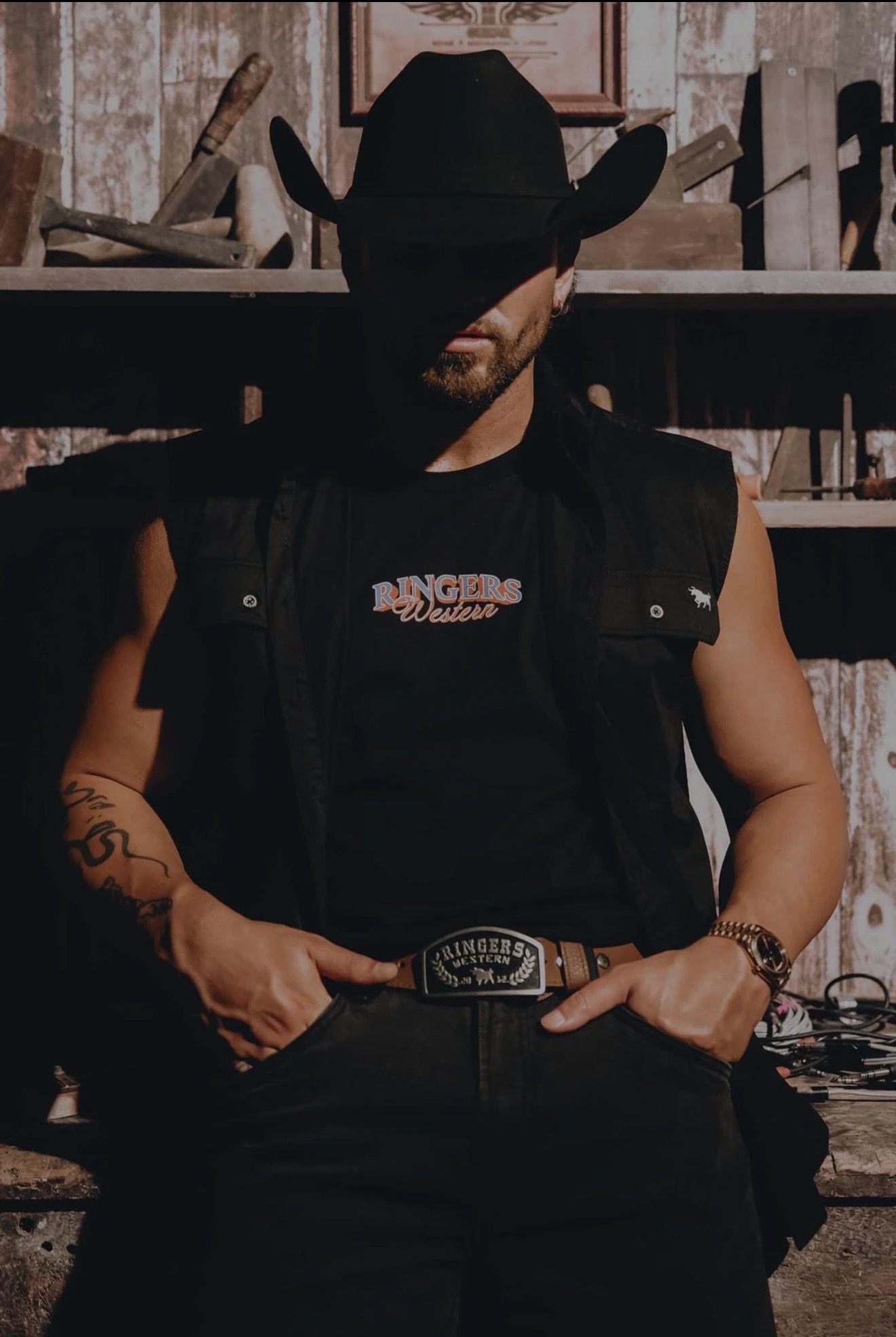 Emersxn wearing a black Ringers Western vest and cowboy hat